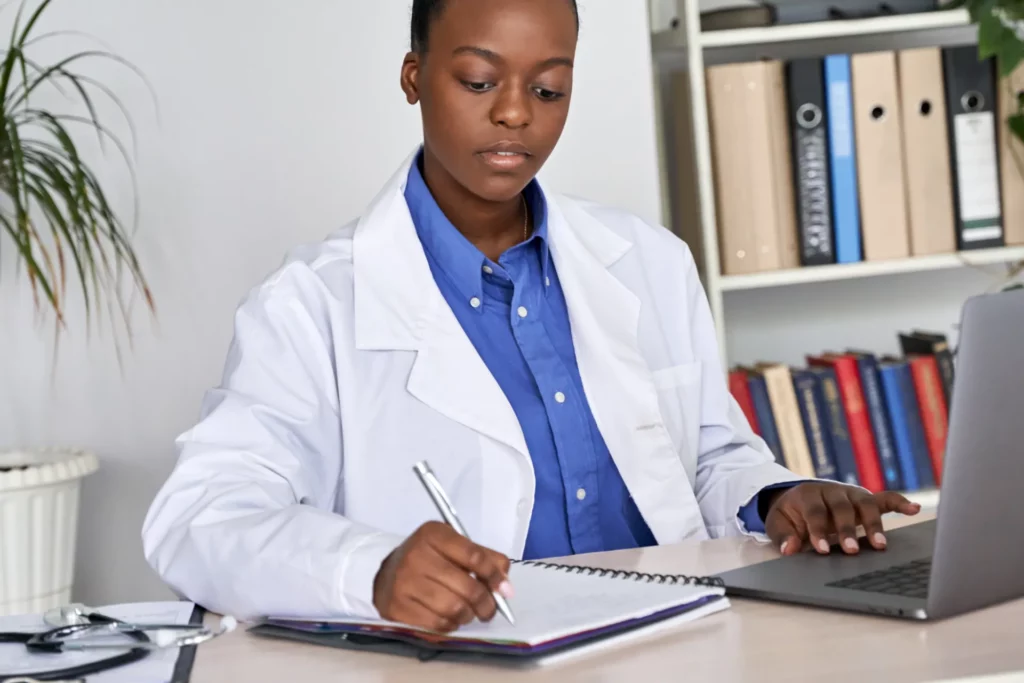 african-american-doctor-writing-medical-record