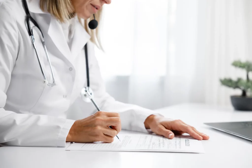 woman-medic-doctor-writes-out-a-prescription